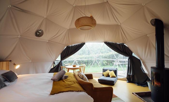 Each dome has a wood burner and infrared heater to keep you warm all year round .. they each have their own private garden, bathroom and kitchen